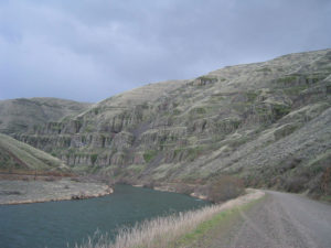 Scenic Photo of Deschutes River and Canyon Rising Above.